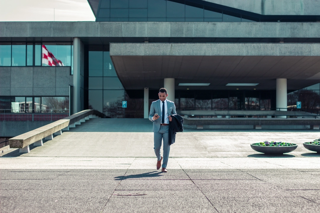 Business man in a suit walking in a business district